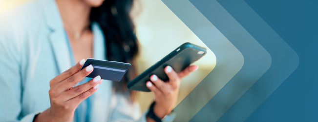 Woman views her cell phone and credit card information.