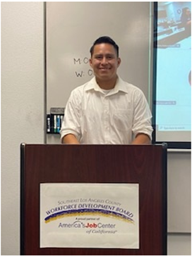 Daniel Ruiz-Camacho standing at a podium