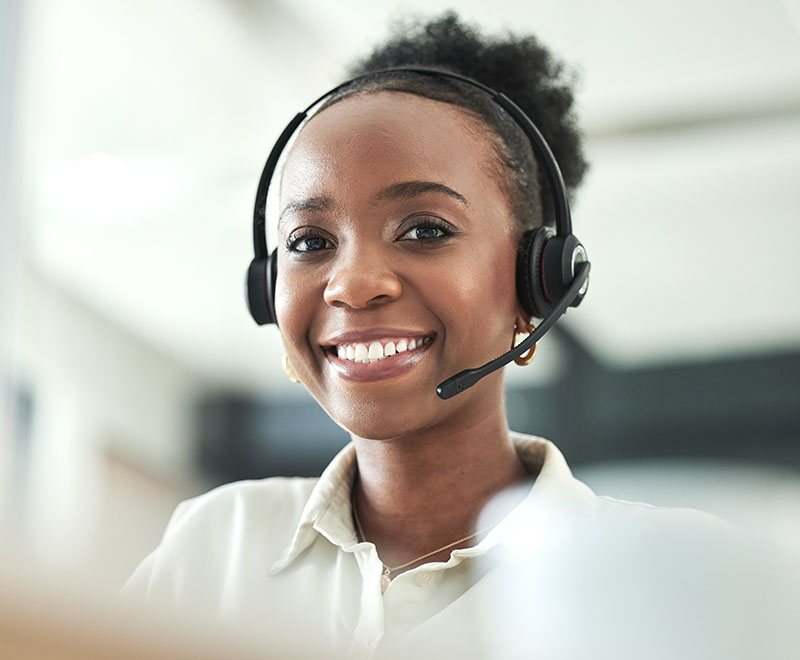 Woman smiling talking on her headset